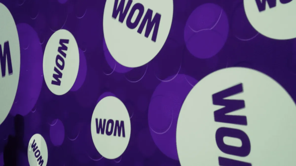 Logo de WOM