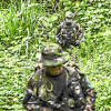 Foto | Tomada de Joaquín Sarmiento / AFP | LAPATRIA  Guerrilleros disidentes de las Farc - Frente Rafael Aguilera caminan en la selva cerca de un campamento en el departamento colombiano de Nariño, el 1 de marzo de 2023.