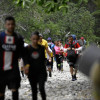 Migrantes cruzando el Tapón del Darién